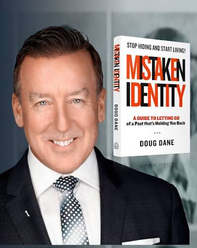 Doug Dane with his book Mistaken Identity